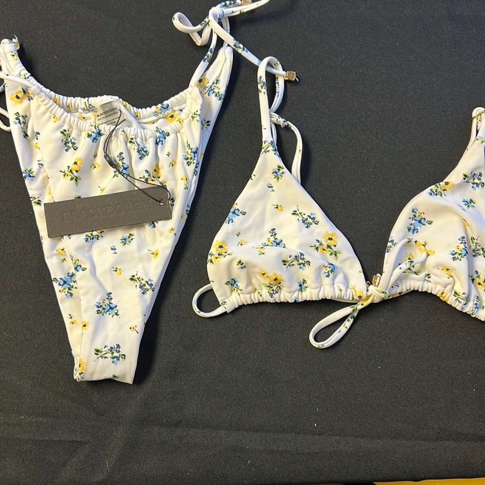 2 bikinis. Bottoms NWT.  Tops new but no tag.  Tops mediums.   Bottoms large